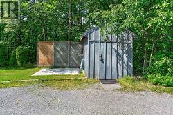 Sturdy shed off the parking area. - 
