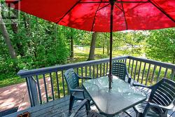 Dine al fresco on the deck, wrapped in nature. - 