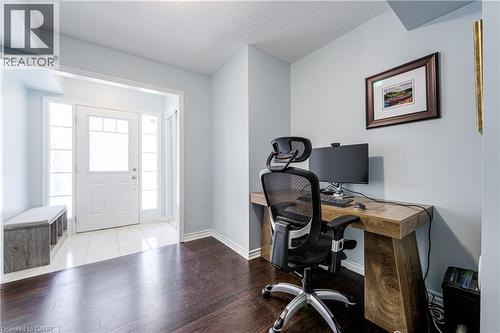 Home office area featuring wood-finish flooring and light blue wall paint - 1000 Asleton Boulevard Unit# 58, Milton, ON - Indoor Photo Showing Office