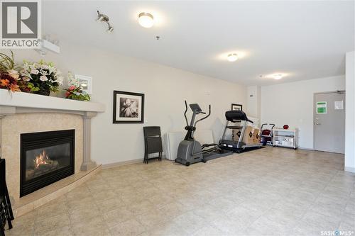303 302 Nelson Road, Saskatoon, SK - Indoor Photo Showing Gym Room With Fireplace