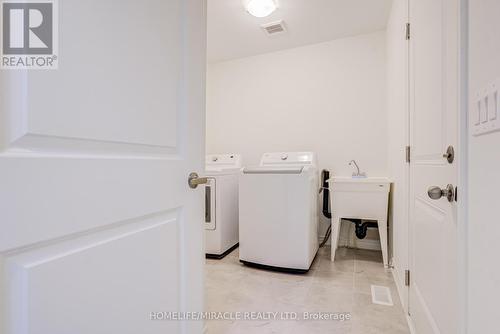 14 Sassafras Road, Springwater, ON - Indoor Photo Showing Laundry Room