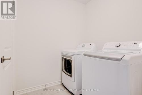14 Sassafras Road, Springwater, ON - Indoor Photo Showing Laundry Room