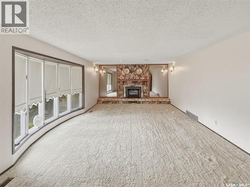 512 1St Street N, Cabri, SK - Indoor Photo Showing Living Room With Fireplace