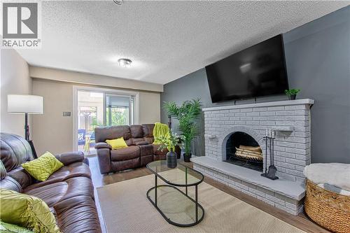Lower Level Family Room - 2560 Palisander Avenue, Mississauga, ON - Indoor Photo Showing Living Room With Fireplace