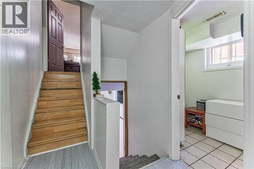 Wood-finish staircase leading to basement - 2560 Palisander Avenue, Mississauga, ON - Indoor Photo Showing Other Room