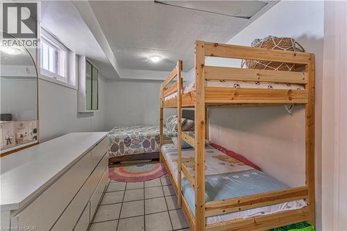 Room featuring ceramic tile flooring, a built-in window, and white walls - 2560 Palisander Avenue, Mississauga, ON - Indoor Photo Showing Bedroom