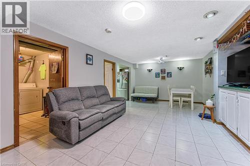 Versatile room featuring tile flooring, recessed lighting, and wall sconces - 2560 Palisander Avenue, Mississauga, ON - Indoor Photo Showing Living Room