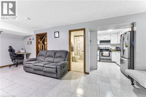 Bright white tile flooring extends throughout this versatile space - 2560 Palisander Avenue, Mississauga, ON - Indoor