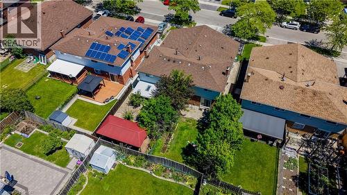 Residential property featuring solar panels on the roof, a spacious back deck with a gazebo, and a manicured lawn - 2560 Palisander Avenue, Mississauga, ON - Outdoor With View