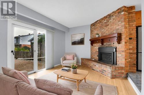 Sunken Family Room virtually staged - 67 Ramsgate Private, Ottawa, ON - Indoor Photo Showing Living Room With Fireplace