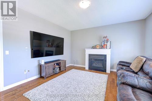 108 Decarolis Crescent, Essa, ON - Indoor Photo Showing Living Room With Fireplace