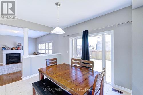 108 Decarolis Crescent, Essa, ON - Indoor Photo Showing Dining Room With Fireplace