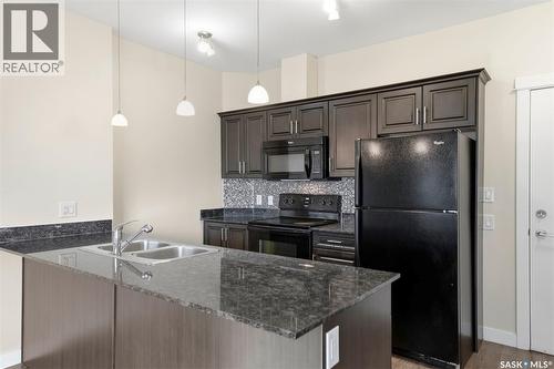104 714 Hart Road, Saskatoon, SK - Indoor Photo Showing Kitchen With Double Sink