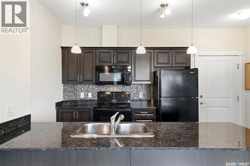 104 714 Hart Road, Saskatoon, SK - Indoor Photo Showing Kitchen With Double Sink With Upgraded Kitchen