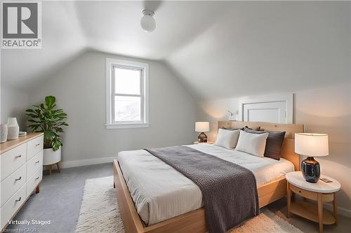 Attic space with sloped ceilings and a single window - 156 Adeline Avenue, Hamilton, ON 
