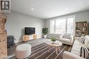 Spacious living area featuring light gray walls, recessed lighting, and wood-finish flooring - 156 Adeline Avenue, Hamilton, ON  - Indoor Photo Showing Living Room 