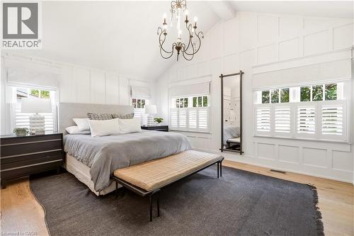 Vaulted ceiling featuring a wrought iron chandelier - 330 Camelot Court, Burlington, ON - Indoor Photo Showing Bedroom