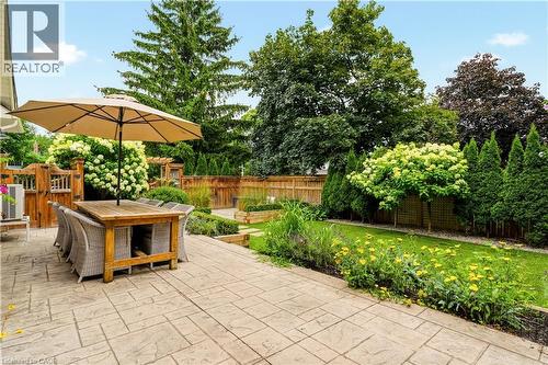 Stamped concrete patio featuring a spacious dining area - 330 Camelot Court, Burlington, ON - Outdoor