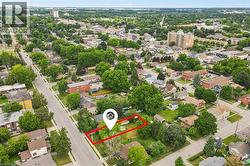 Aerial perspective showcasing a residential property with surrounding green space - 