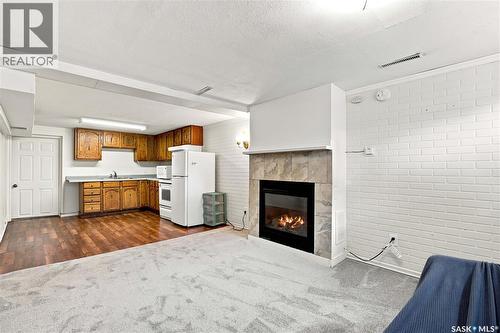 1607 Alexandra Avenue, Saskatoon, SK - Indoor Photo Showing Other Room With Fireplace