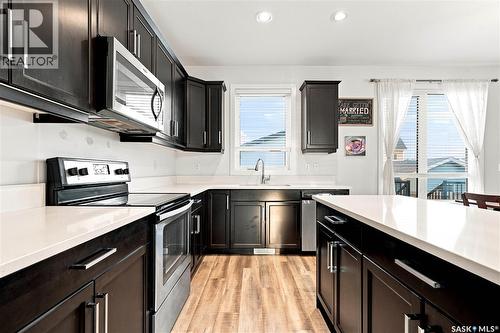 659 Secord Bend, Saskatoon, SK - Indoor Photo Showing Kitchen With Stainless Steel Kitchen With Upgraded Kitchen