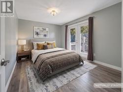Primary Bedroom w/ Patio Doors to Back Deck - 