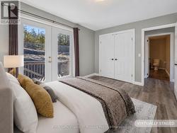 Primary Bedroom w/ Patio Doors to Back Deck - 