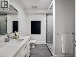 White vanity with integrated sink, chrome faucet, and rectangular mirror - 