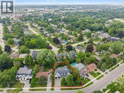 Aerial perspective showcasing a residential area with mature trees and established properties - 