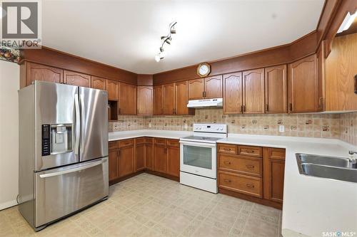 114 First Avenue W, Vanscoy, SK - Indoor Photo Showing Kitchen With Double Sink