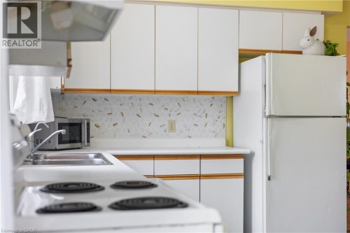 LARGE EAT IN KITCHEN WITH 3 FRIDGES - 25 Saunby Street, London, ON - Indoor Photo Showing Kitchen
