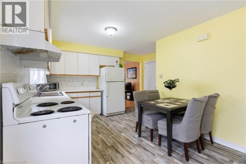 LARGE EAT IN KITCHEN WITH 3 FRIDGES - 25 Saunby Street, London, ON - Indoor Photo Showing Kitchen