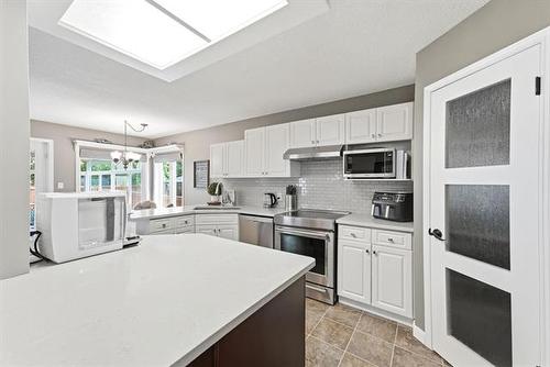 141 Invermere St, Winnipeg, MB - Indoor Photo Showing Kitchen With Double Sink