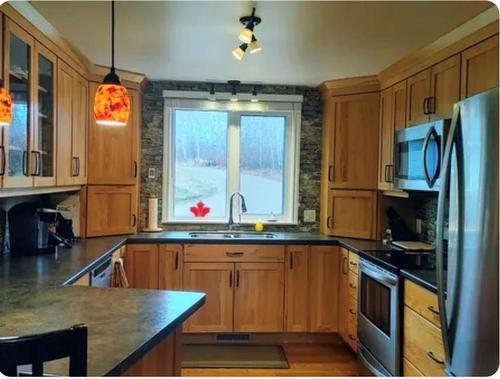 48 Sunset Drive, Ditch Lake, MB - Indoor Photo Showing Kitchen With Double Sink