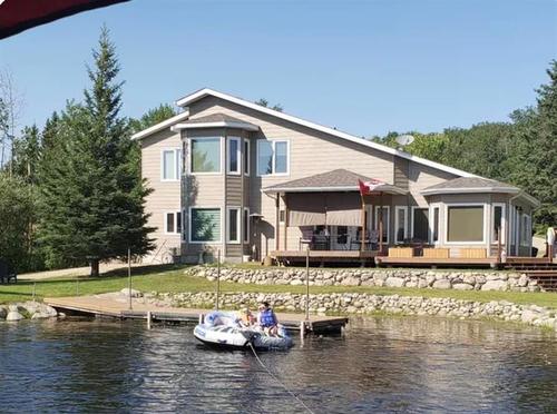 48 Sunset Drive, Ditch Lake, MB - Outdoor With Body Of Water With Deck Patio Veranda