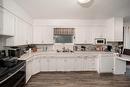 411 Ash Avenue, Steinbach, MB  - Indoor Photo Showing Kitchen With Double Sink 