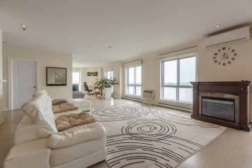 Salon - 716-7680 Boul. Marie-Victorin, Brossard, QC - Indoor Photo Showing Living Room With Fireplace