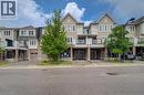 Multi-story townhome featuring light-toned siding and brick accents - 911 Apple Hill Lane, Kitchener, ON  - Outdoor With Balcony With Facade 