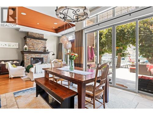 8049 Okanagan Landing Road, Vernon, BC - Indoor Photo Showing Dining Room With Fireplace