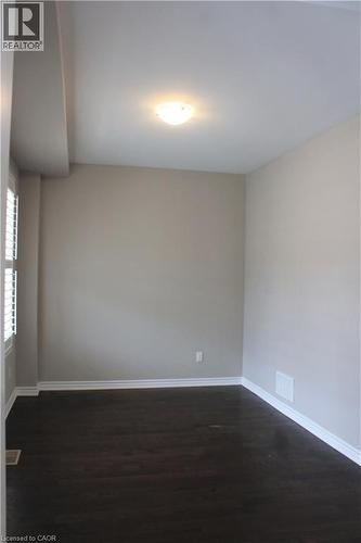 Room featuring dark wood-finish flooring, light-toned walls, and white trim molding - 31 Pointer Street Unit# Main Floor, Cambridge, ON - Indoor Photo Showing Other Room