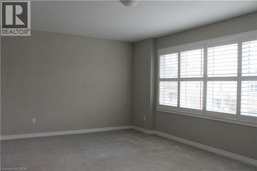 Generous window with white plantation shutters - 31 Pointer Street Unit# Main Floor, Cambridge, ON - Indoor Photo Showing Other Room