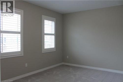 Neutral-toned walls complementing plush grey carpeting - 31 Pointer Street Unit# Main Floor, Cambridge, ON - Indoor Photo Showing Other Room