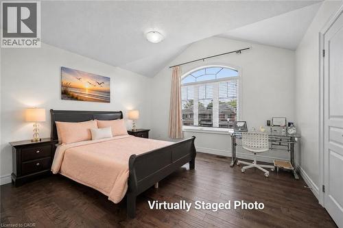 Bedroom featuring wood-finish flooring and a vaulted ceiling - 145 Redtail Street, Kitchener, ON - Indoor Photo Showing Bedroom