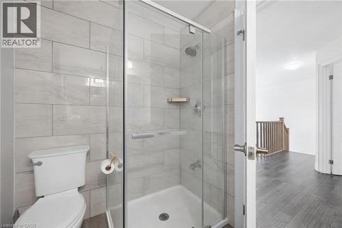 Bathroom featuring a glass-enclosed shower with light gray subway tile surround and a chrome shower head - 145 Redtail Street, Kitchener, ON - Indoor Photo Showing Bathroom