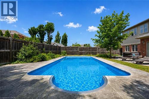Rectangular inground pool with concrete surround - 145 Redtail Street, Kitchener, ON - Outdoor With In Ground Pool With Deck Patio Veranda With Backyard