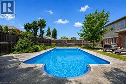 Rectangular inground pool with concrete surround - 
