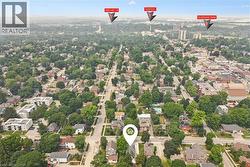 Aerial view of a residential neighborhood with verdant tree cover - 