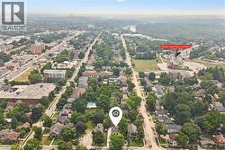 Aerial perspective showcasing a mature residential neighborhood with established trees - 