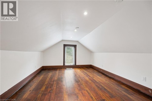 Attic space featuring wood-finish flooring, white walls, and a gabled ceiling with recessed lighting - 245 Lowther Street S, Cambridge, ON - Indoor Photo Showing Other Room