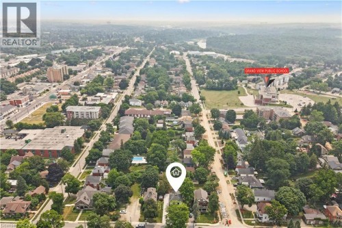 Aerial perspective showcasing a mature residential neighborhood with established trees - 245 Lowther Street S, Cambridge, ON - Outdoor With View